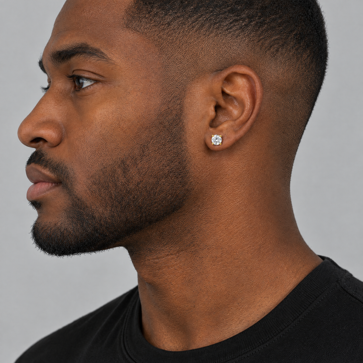 Gold moissanite stud earring on model
