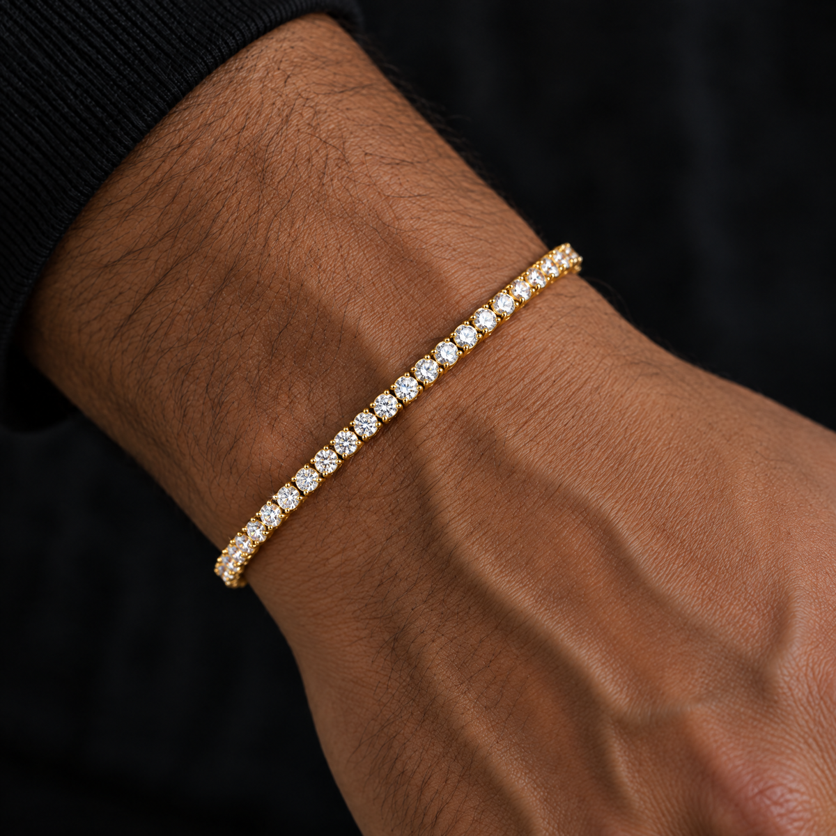 Gold moissanite tennis bracelet on wrist
